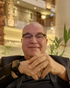 Anjo De Heus, founder of 360Disruption and creator of ActivationAtlas, seated in a hotel lounge during a strategic business meeting in the UAE.